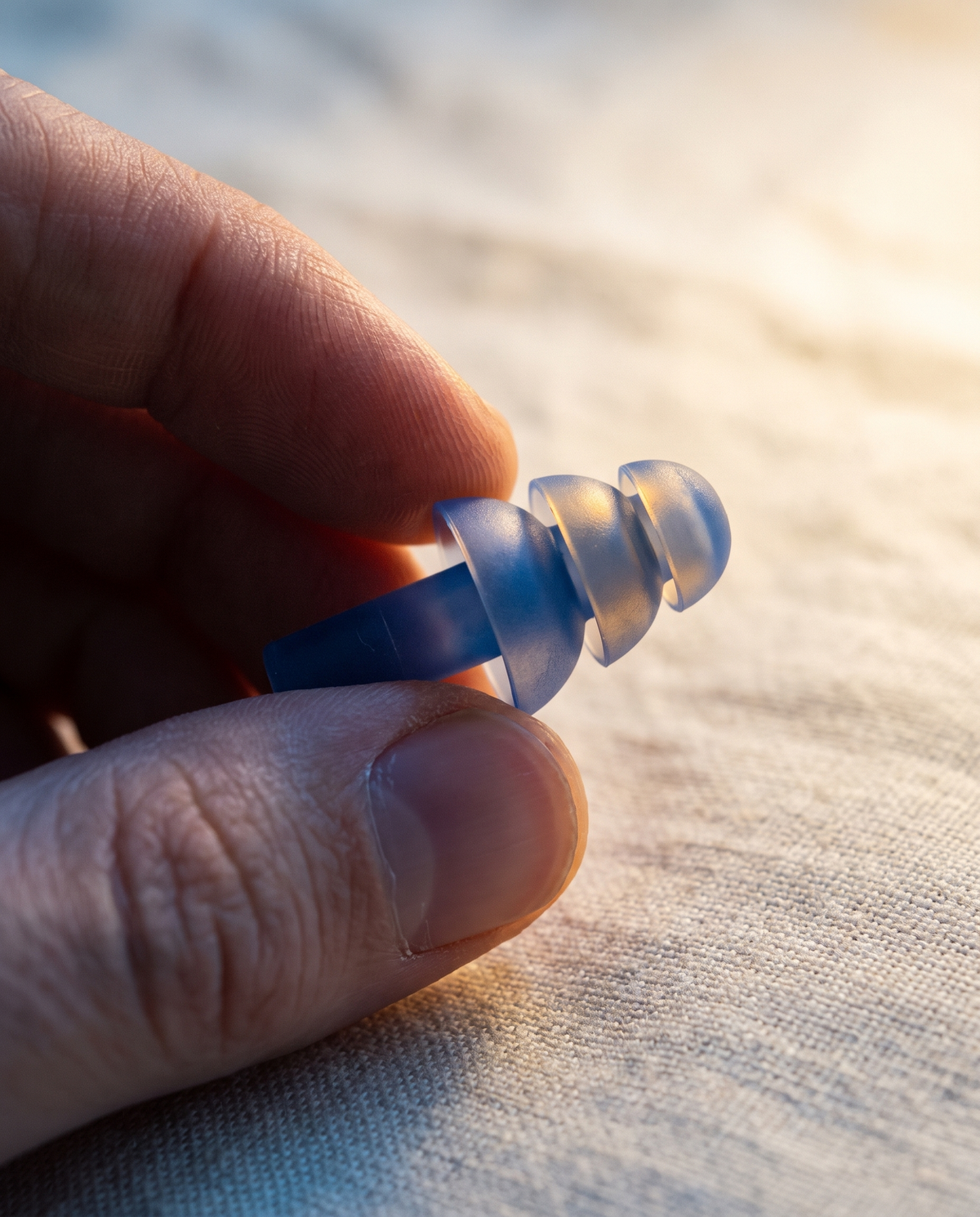 Gros plan sur les ailettes souples d'un bouchon d'oreille